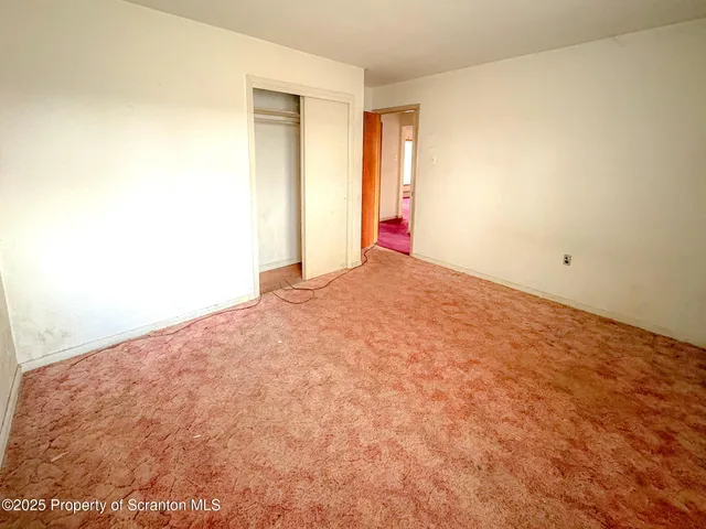 en empty room with windows