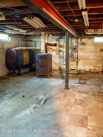 a view of a house with a yard and trees