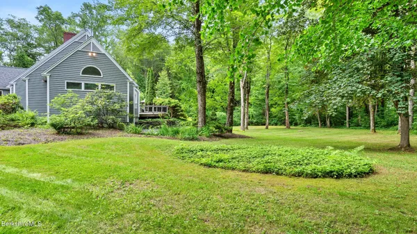 a view of a house with a garden