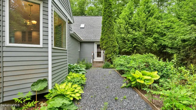 a kitchen with a sink cabinets and wooden floor