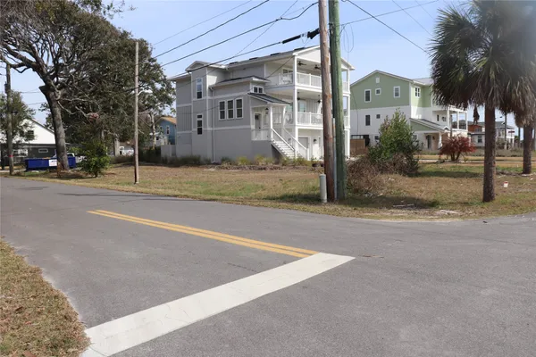 a view of a street with a building in the background