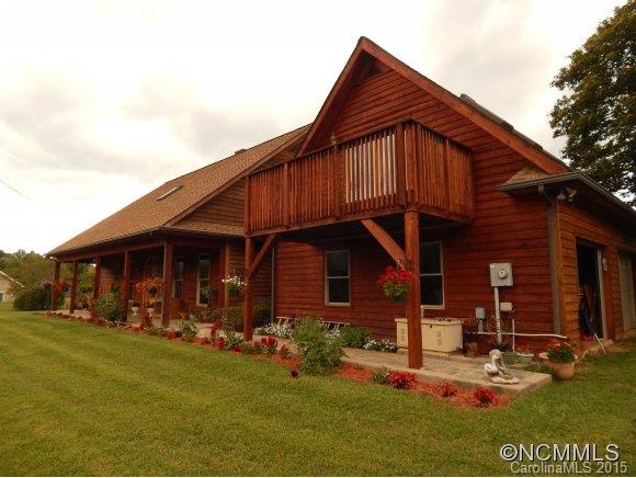 565 Jenkins Road Canton, NC 28716 - Photo 1 of 22 a front view of a house with garden