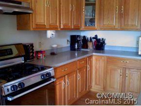 565 Jenkins Road Canton, NC 28716 - Photo 13 of 22 a kitchen with stainless steel appliances granite countertop a stove and cabinets