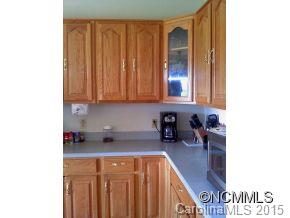 565 Jenkins Road Canton, NC 28716 - Photo 14 of 22 a kitchen with a sink and cabinets