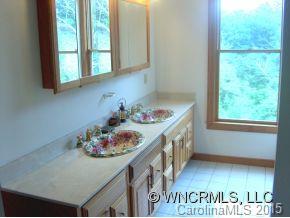 565 Jenkins Road Canton, NC 28716 - Photo 17 of 22 a kitchen with a sink and cabinets