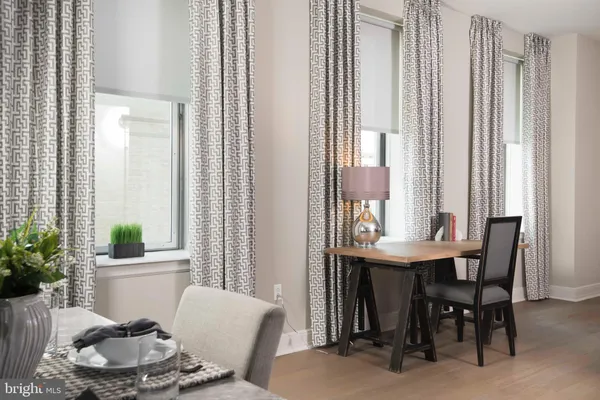a kitchen with a refrigerator and a stove top oven