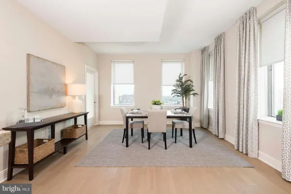 a living room with furniture and a rug