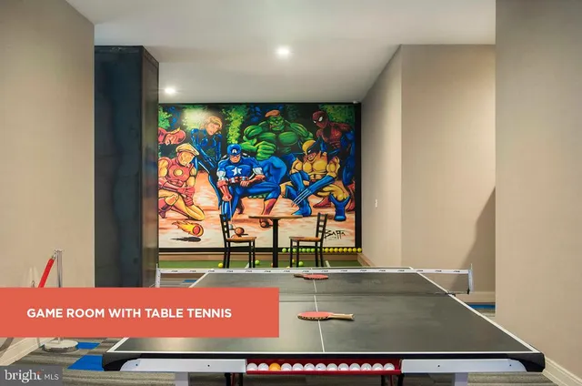 a picture of a living room with a rug and a floor to ceiling window