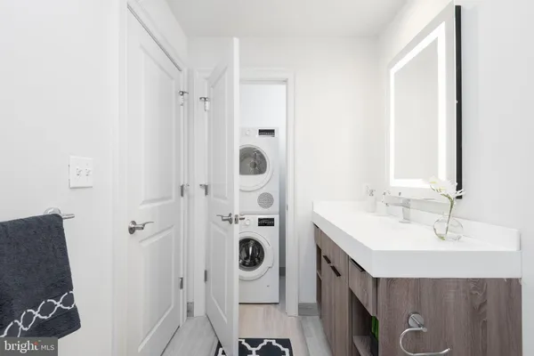 a bathroom with a mirror a sink and a mirror