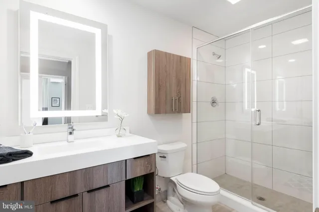 a bedroom with a bed and a wall painting