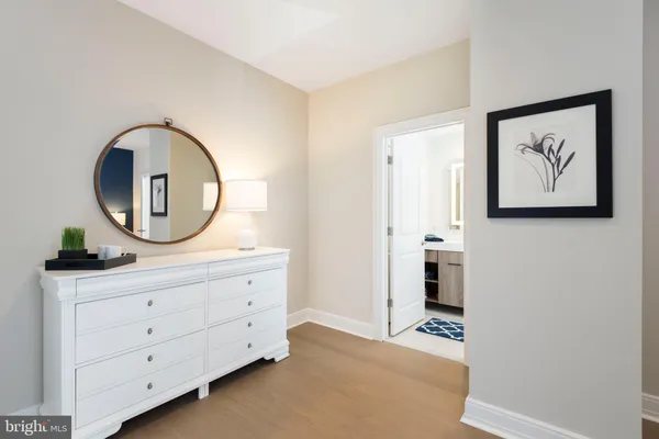 a kitchen with stainless steel appliances a stove microwave and refrigerator