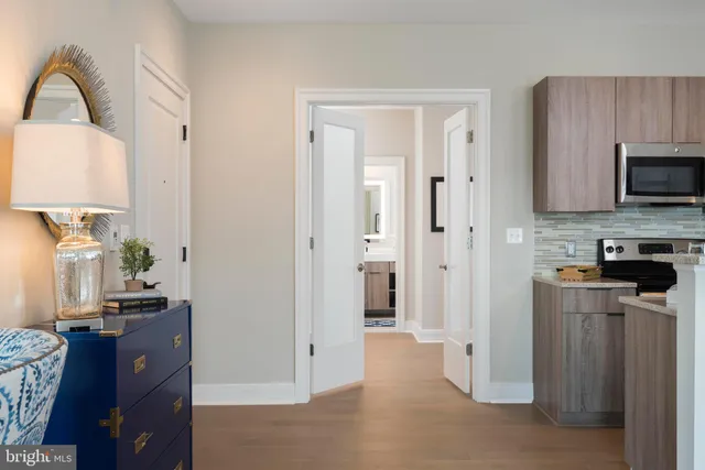 a living room with furniture and painting on the wall