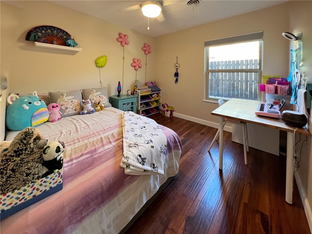 1807 Barbara Street Austin, TX 78757 - Photo 18 of 25 BEDROOM 2 IN MIDDLE OF HOUSE. WOOD FLOORS. GOOD SIZE