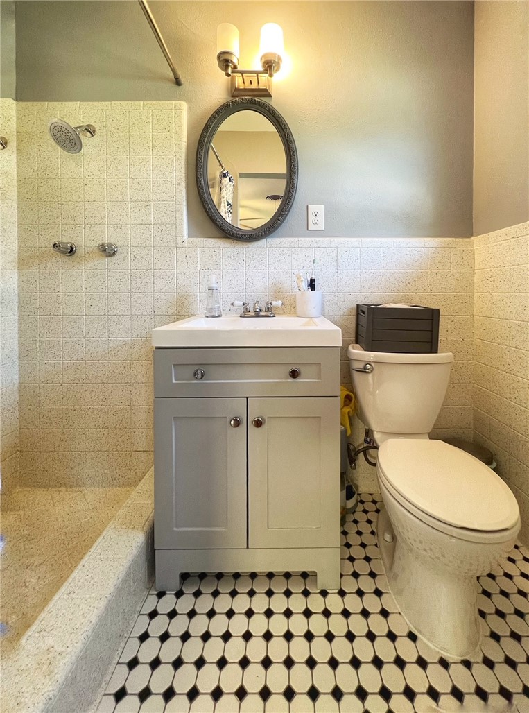 1807 Barbara Street Austin, TX 78757 - Photo 21 of 25 UPDATED MASTER BATH WITH LARGE WALK-IN SHOWER AND TILE FLOORS