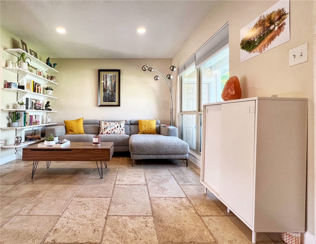 1807 Barbara Street Austin, TX 78757 - Photo 6 of 25 RIGHT SIDE OF LIVING AREA. STONE FLOORS. GOOD LIGHTING. BUILT-INS STAY