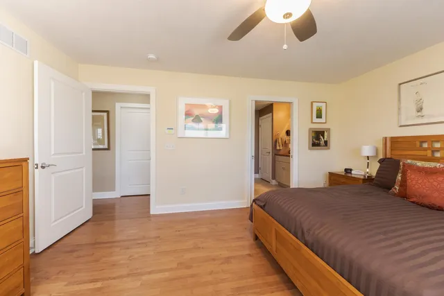 a spacious bedroom with a bed and a couch