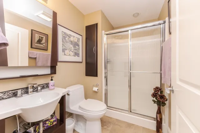 a dining room with furniture and a flat screen tv