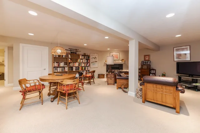a dining room with furniture and window