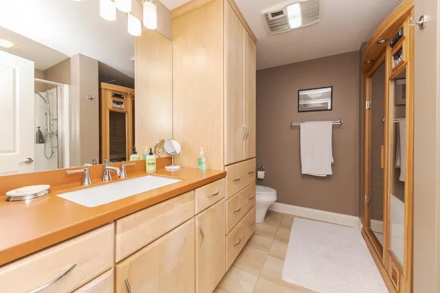 a bedroom with a bed and a cabinets