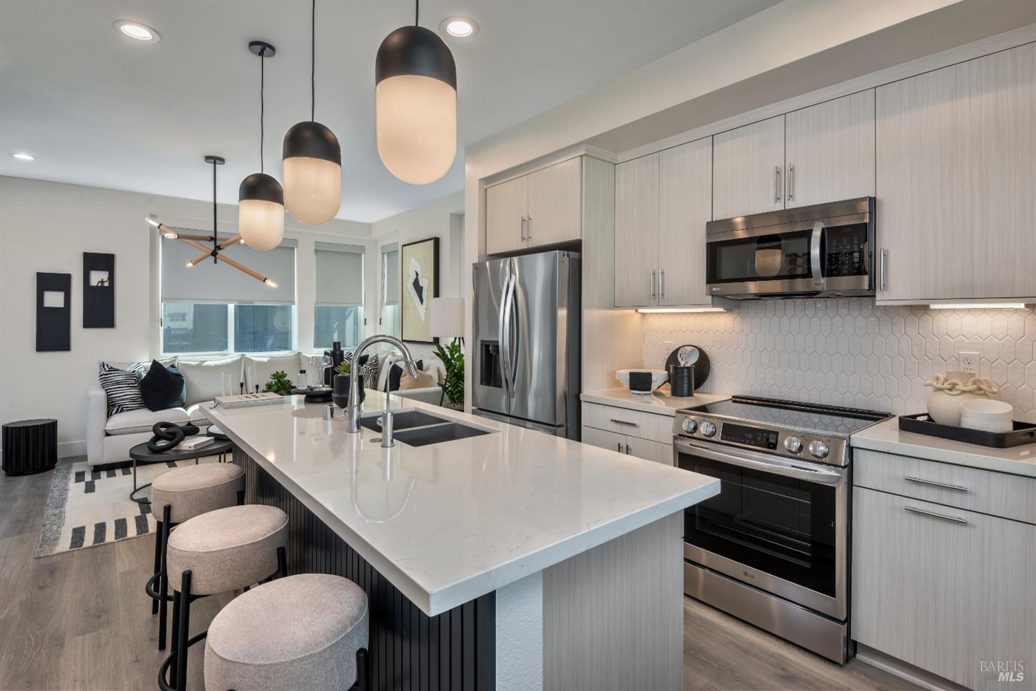 247 Montague Expressway Milpitas, CA 95035 - Photo 4 of 5 a kitchen with a table chairs stove and microwave