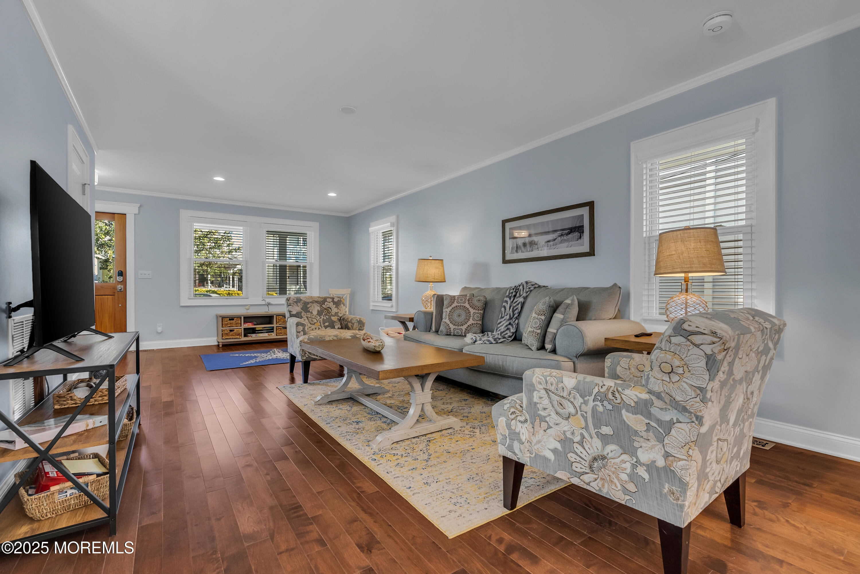 52 Embury Avenue Ocean Grove, NJ 07756 - Photo 12 of 88 a living room with fireplace furniture and a flat screen tv