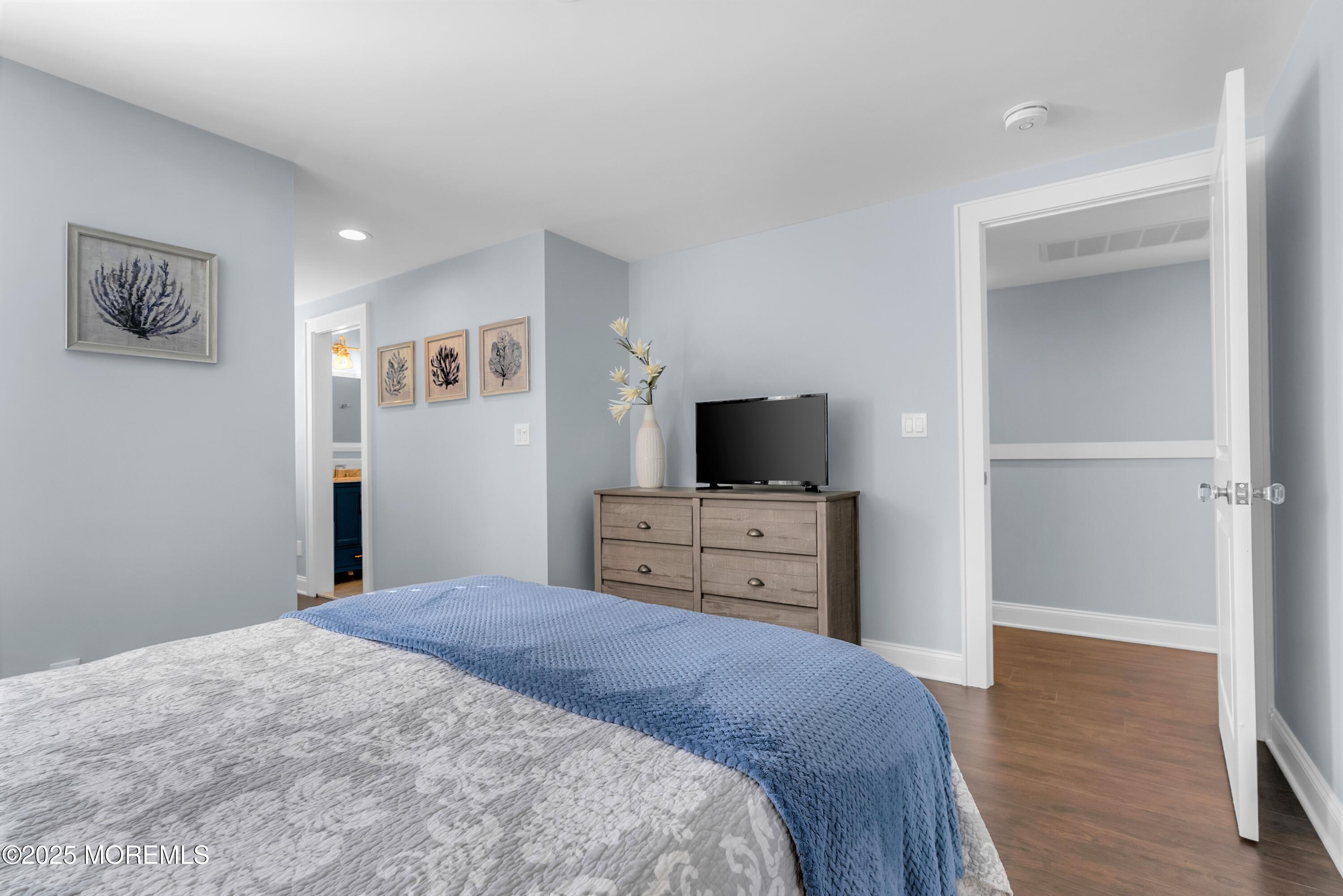 52 Embury Avenue Ocean Grove, NJ 07756 - Photo 24 of 88 a bedroom with a bed and a flat screen tv