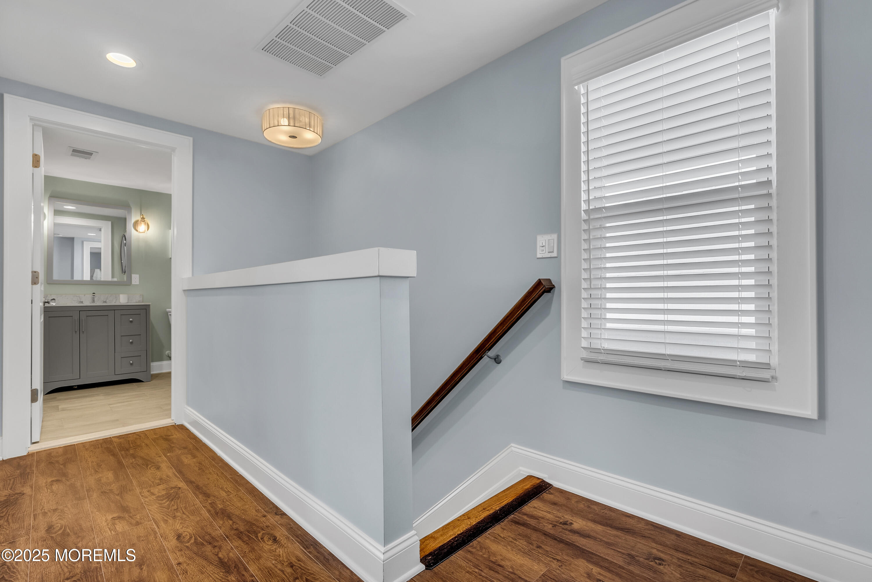 52 Embury Avenue Ocean Grove, NJ 07756 - Photo 29 of 88 a view of empty room with wooden floor and fan