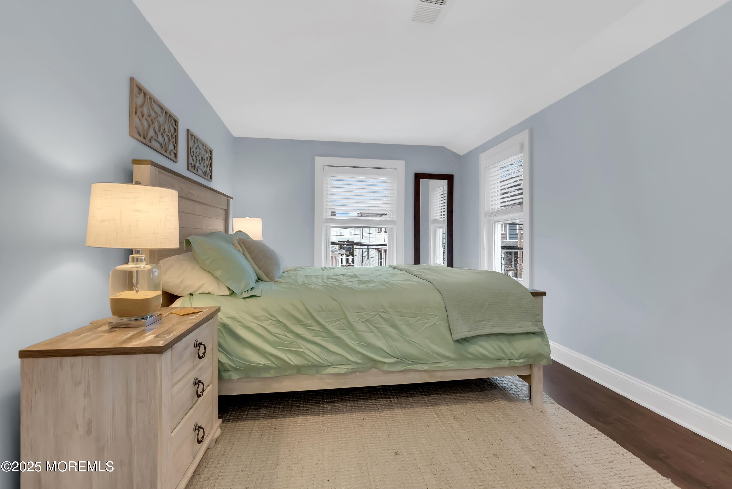 52 Embury Avenue Ocean Grove, NJ 07756 - Photo 33 of 88 a bedroom with a bed wooden floor and lamp
