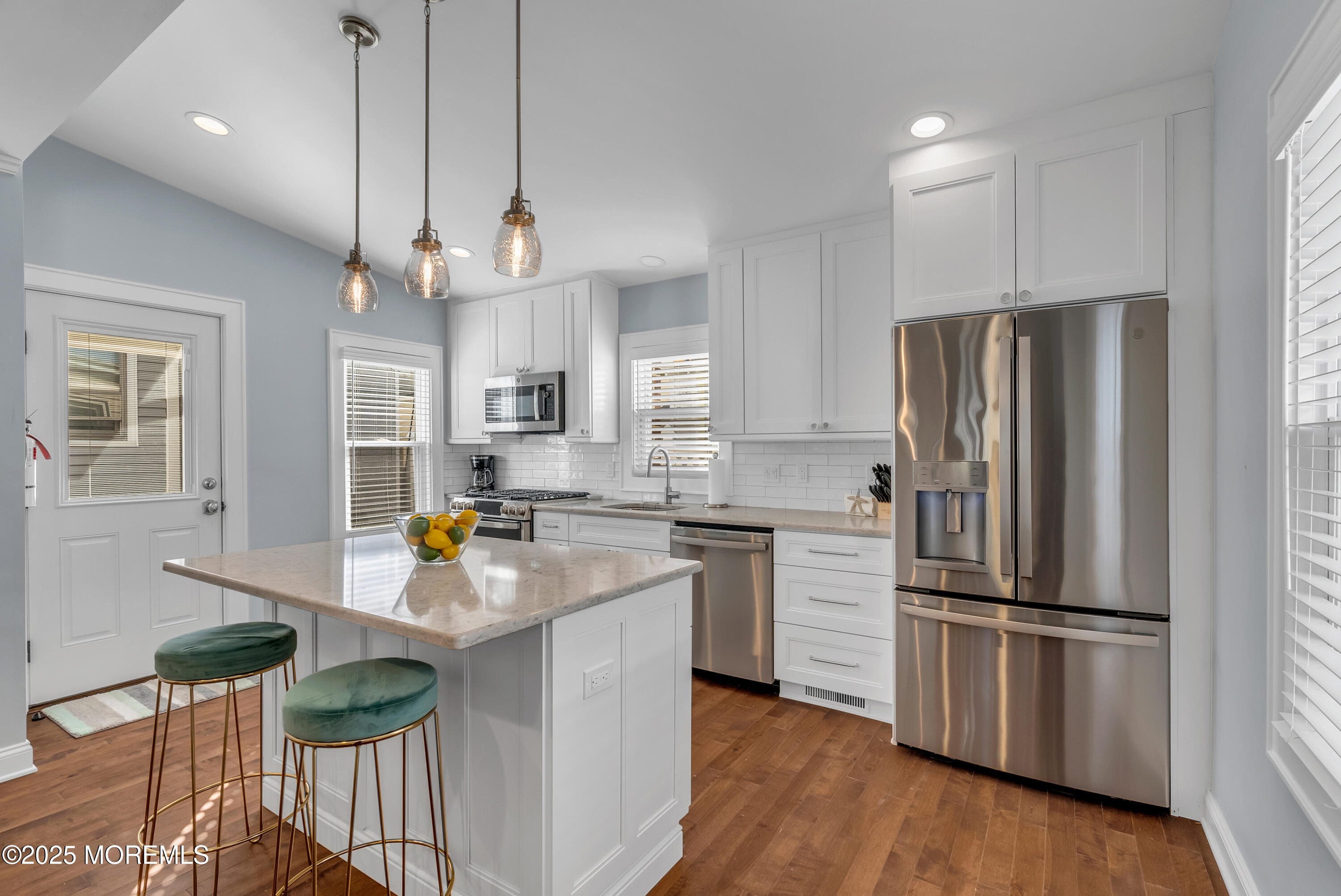 52 Embury Avenue Ocean Grove, NJ 07756 - Photo 6 of 88 a kitchen with stainless steel appliances granite countertop a refrigerator a stove a sink dishwasher and a refrigerator with wooden floor