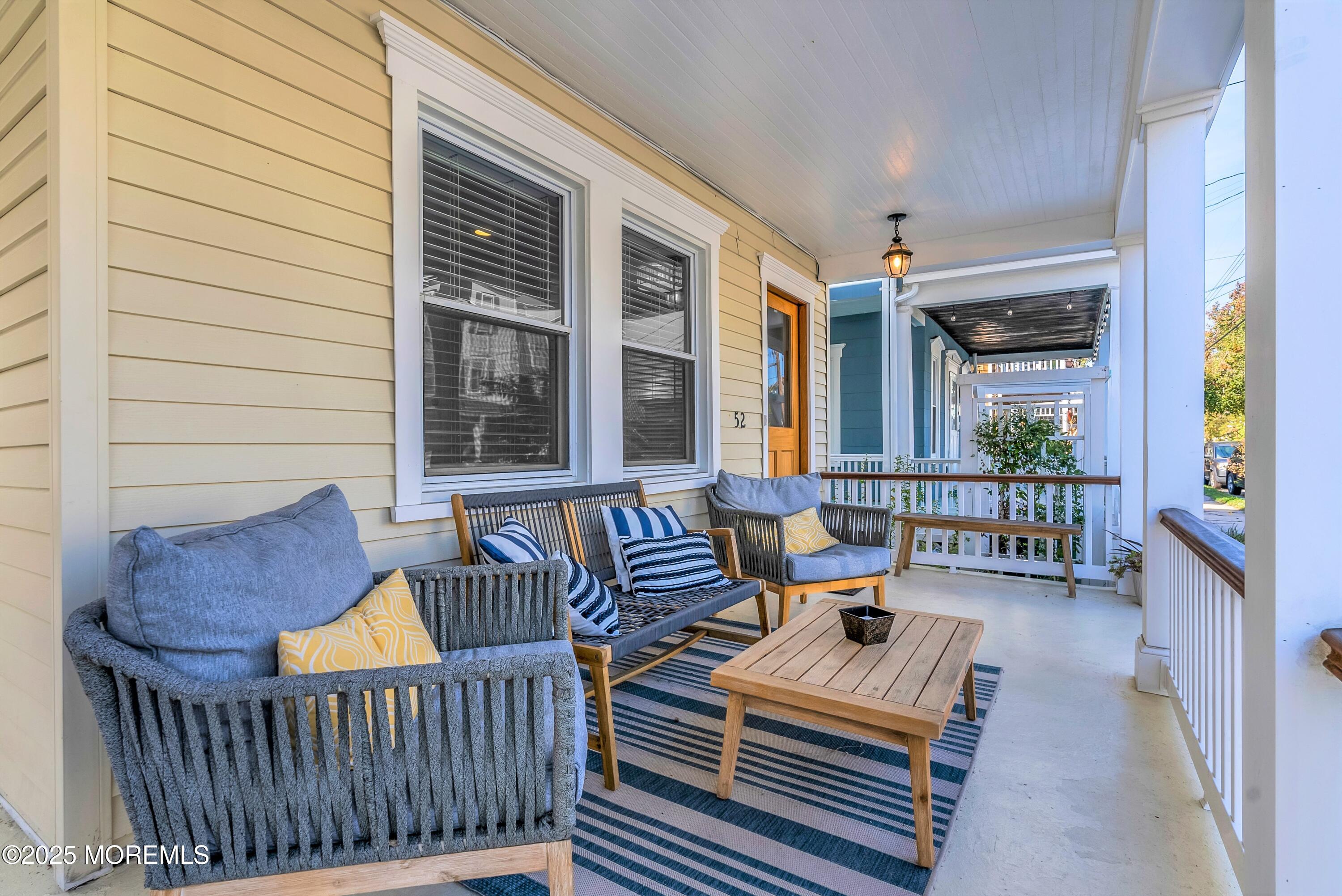 52 Embury Avenue Ocean Grove, NJ 07756 - Photo 9 of 88 a view of a chair and table in the balcony