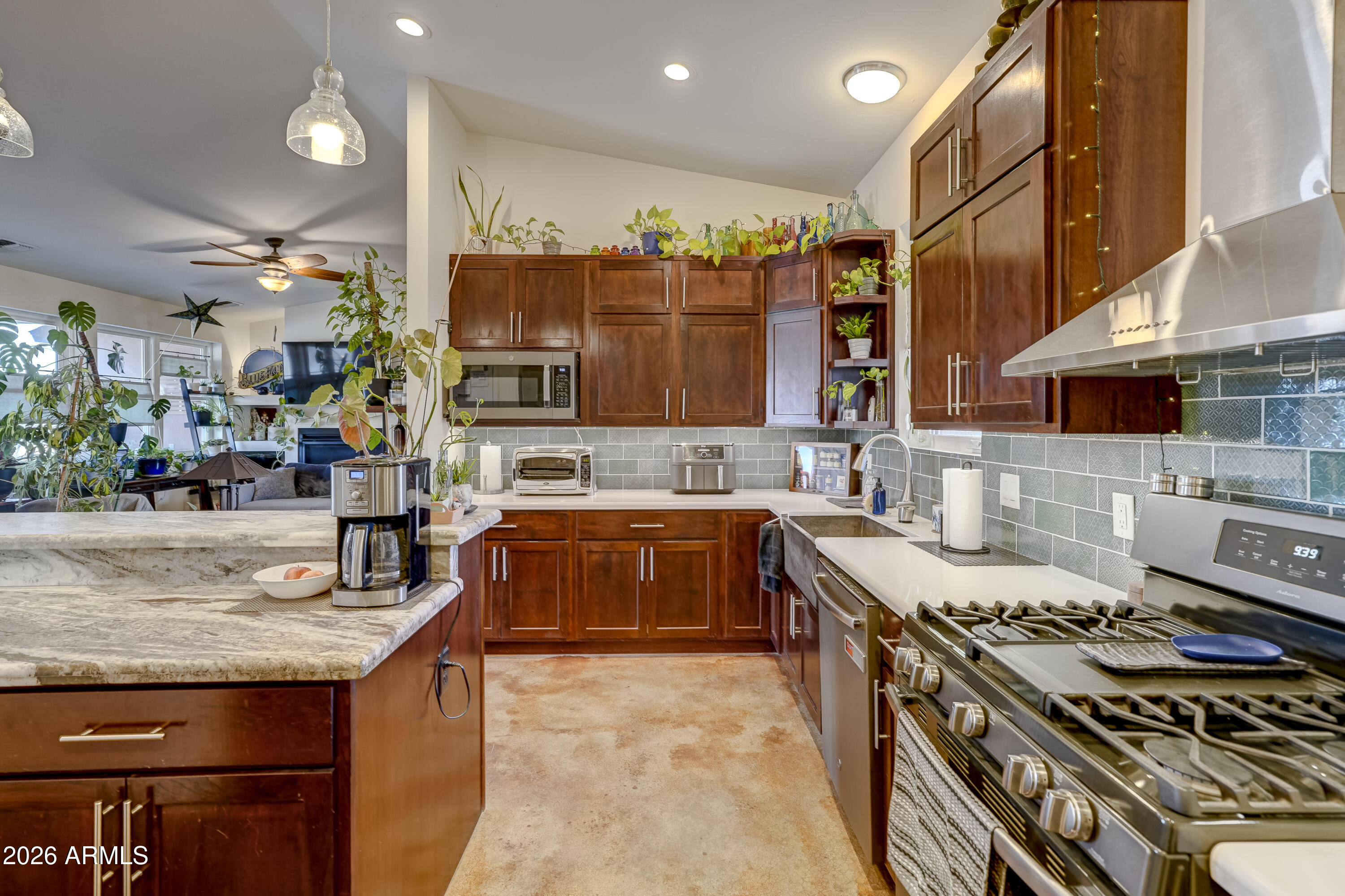 2771 South Country Hill Road Cornville, AZ 86325 - Photo 14 of 20 a kitchen with stainless steel appliances granite countertop a stove and a sink