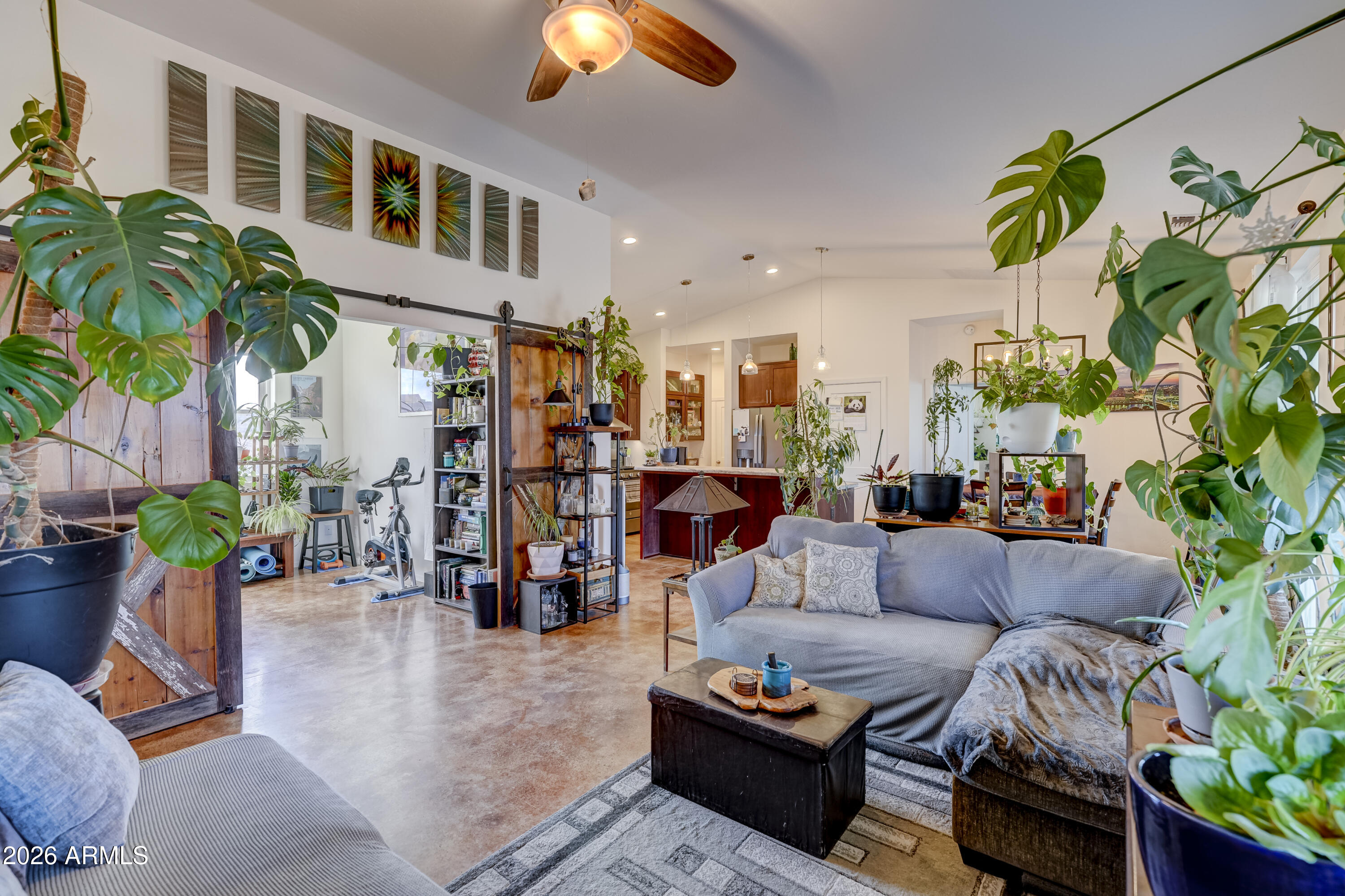 2771 South Country Hill Road Cornville, AZ 86325 - Photo 16 of 20 a living room filled with furniture and a potted plant