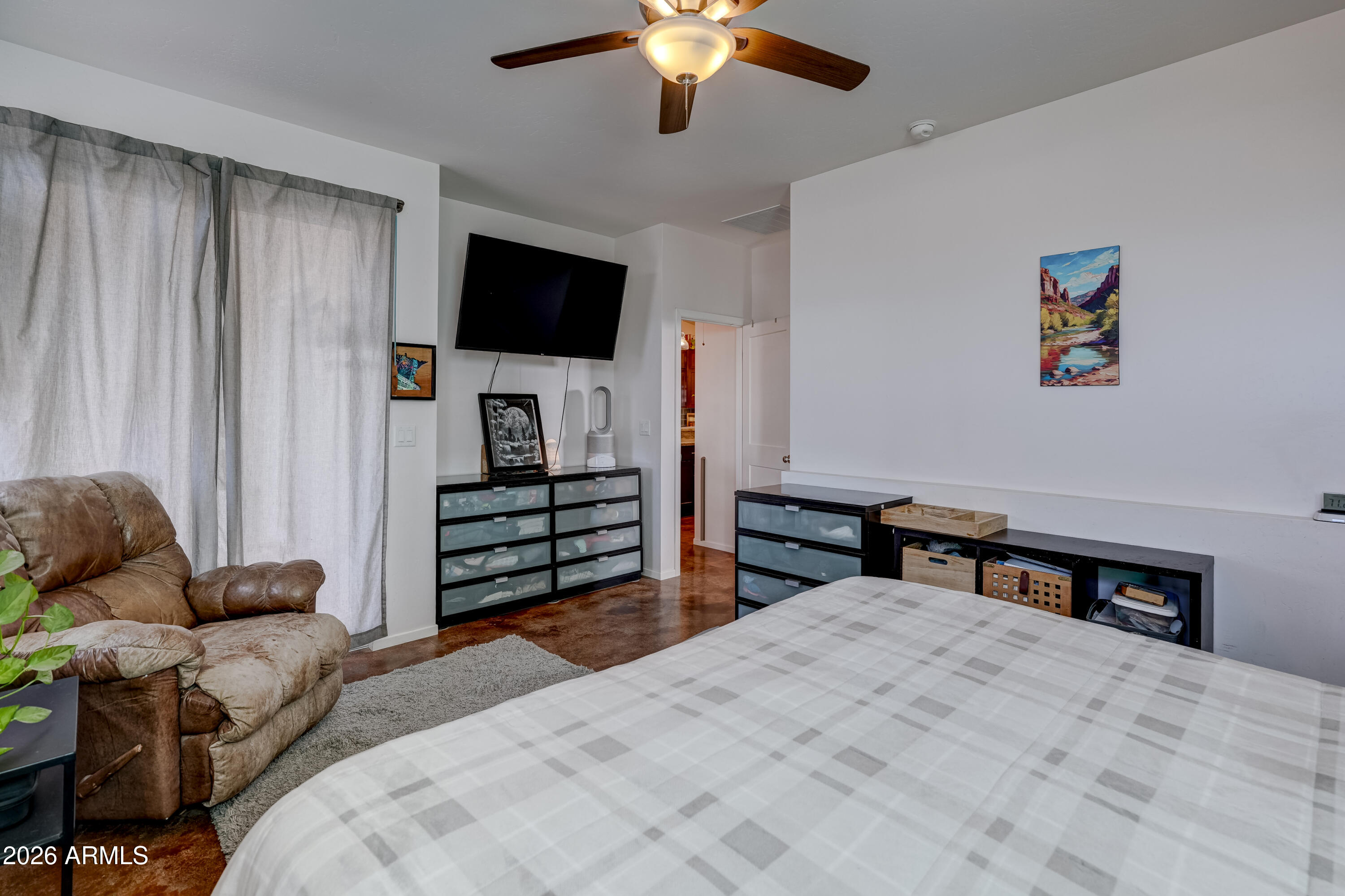 2771 South Country Hill Road Cornville, AZ 86325 - Photo 20 of 20 a bedroom with furniture and a flat screen tv