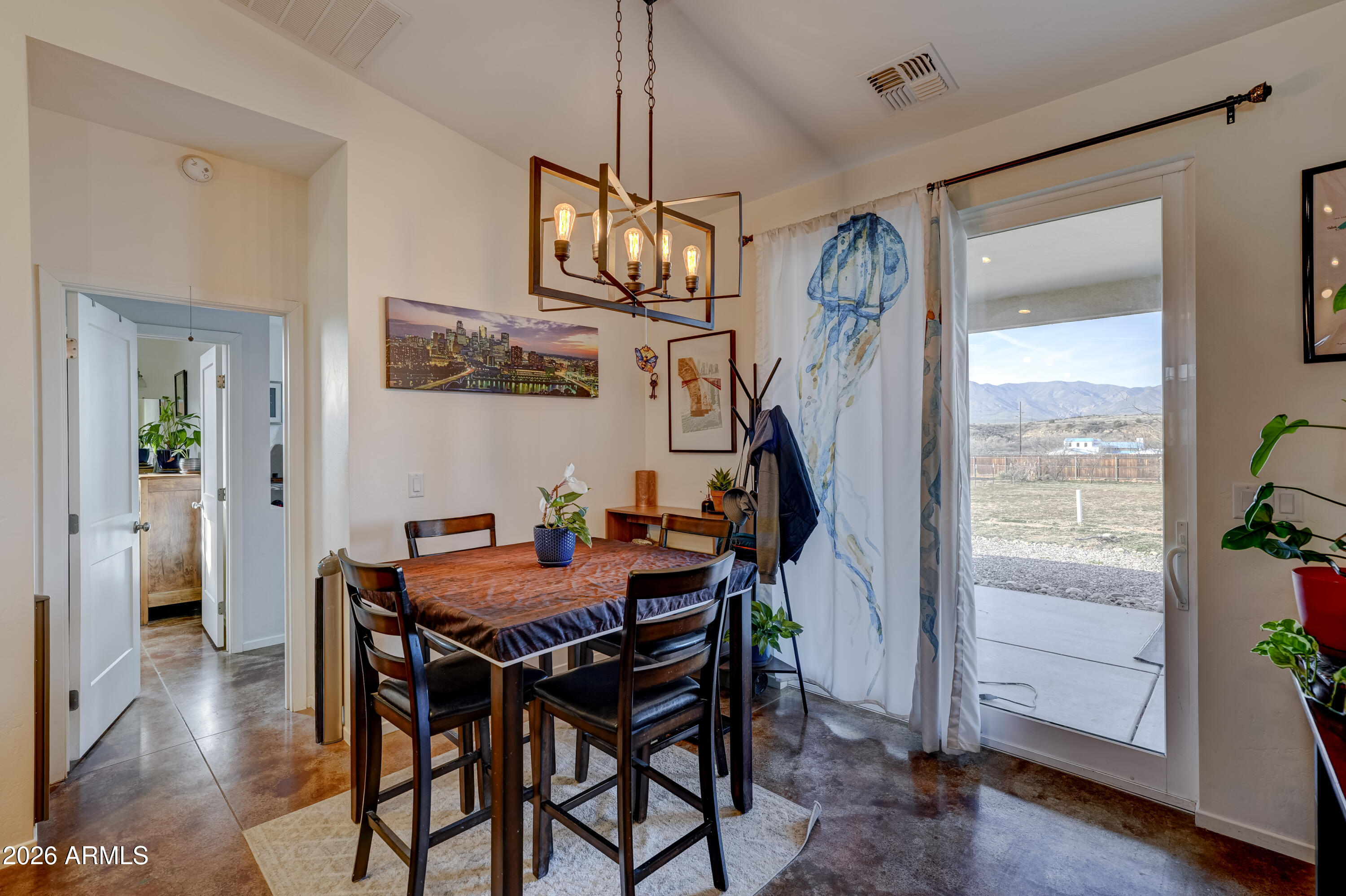 2771 South Country Hill Road Cornville, AZ 86325 - Photo 10 of 20 a view of a dining room with furniture and wooden floor