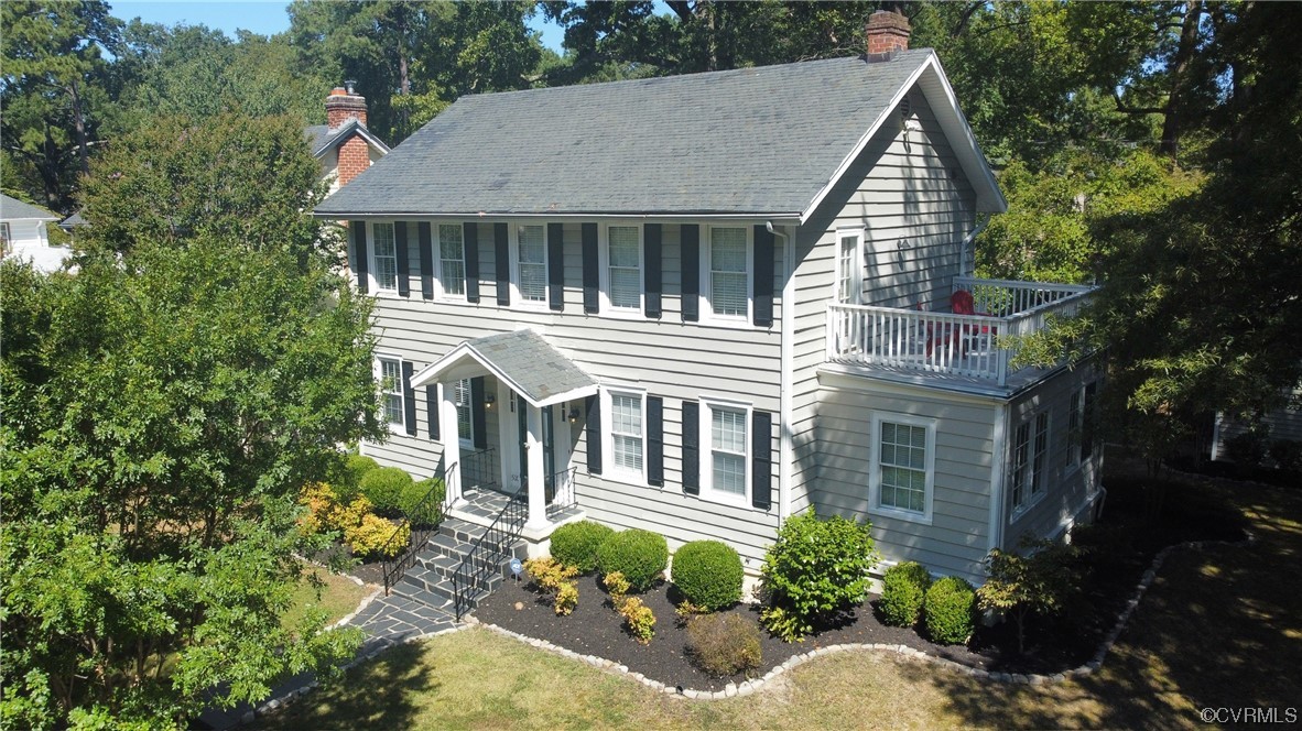 5009 Devonshire Road Richmond, VA 23225 - Photo 1 of 43 a view of a house with a flower garden