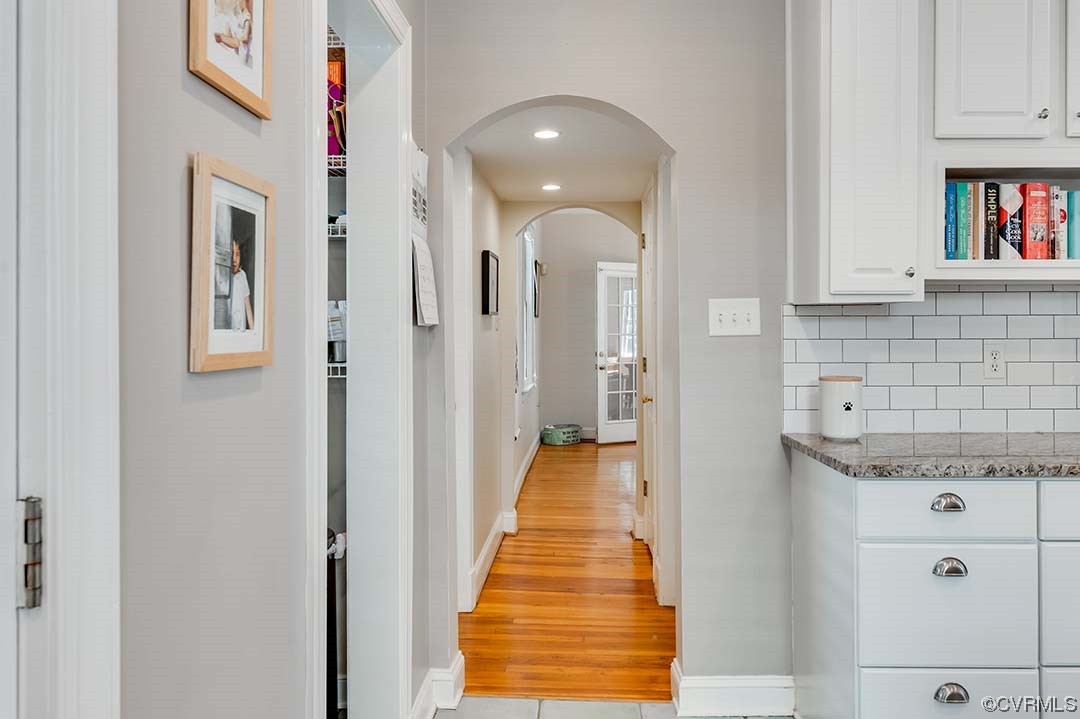 5009 Devonshire Road Richmond, VA 23225 - Photo 11 of 43 a hallway with white cabinets