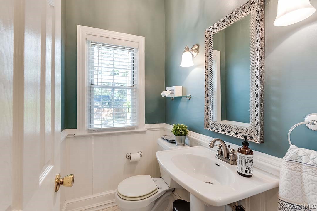 5009 Devonshire Road Richmond, VA 23225 - Photo 16 of 43 a bathroom with a sink a toilet and a mirror