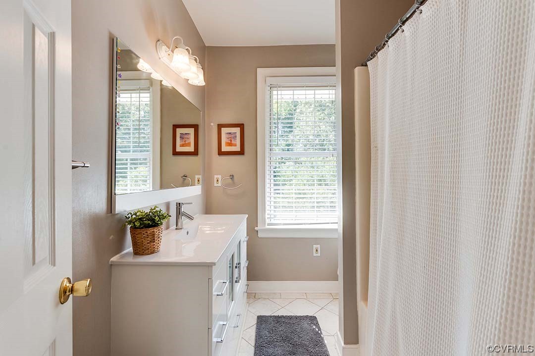 5009 Devonshire Road Richmond, VA 23225 - Photo 22 of 43 a room with a window a sink and dryer