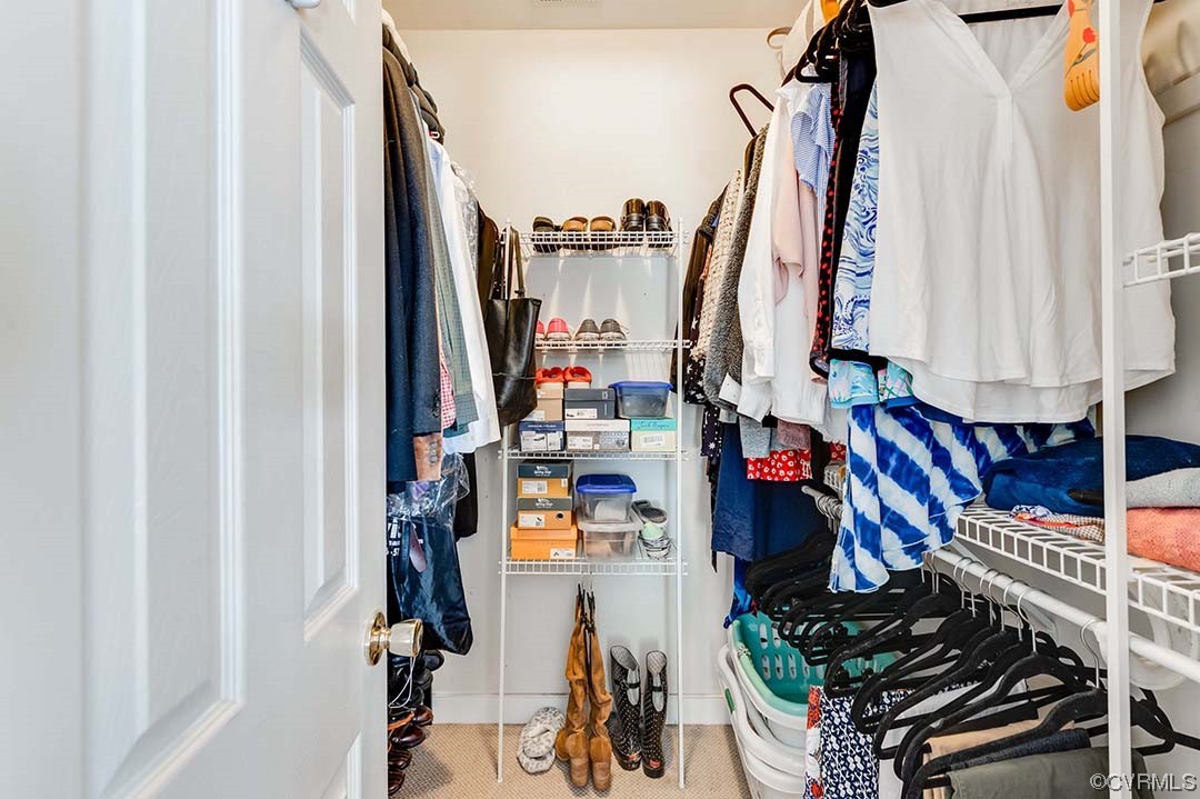 5009 Devonshire Road Richmond, VA 23225 - Photo 26 of 43 a view of walk in closet with clothes and shoes