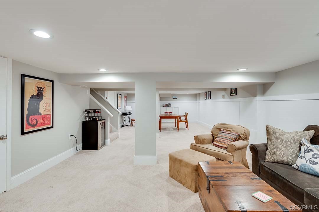 5009 Devonshire Road Richmond, VA 23225 - Photo 31 of 43 a living room with furniture gym equipment and a ceiling fan