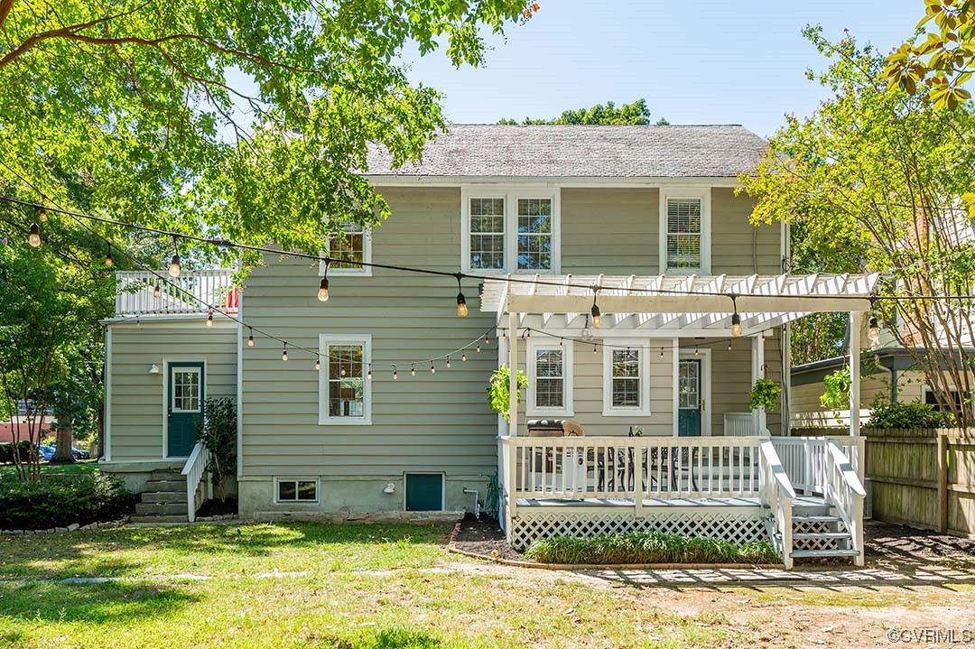 5009 Devonshire Road Richmond, VA 23225 - Photo 36 of 43 a view of a brick house with many windows and a yard