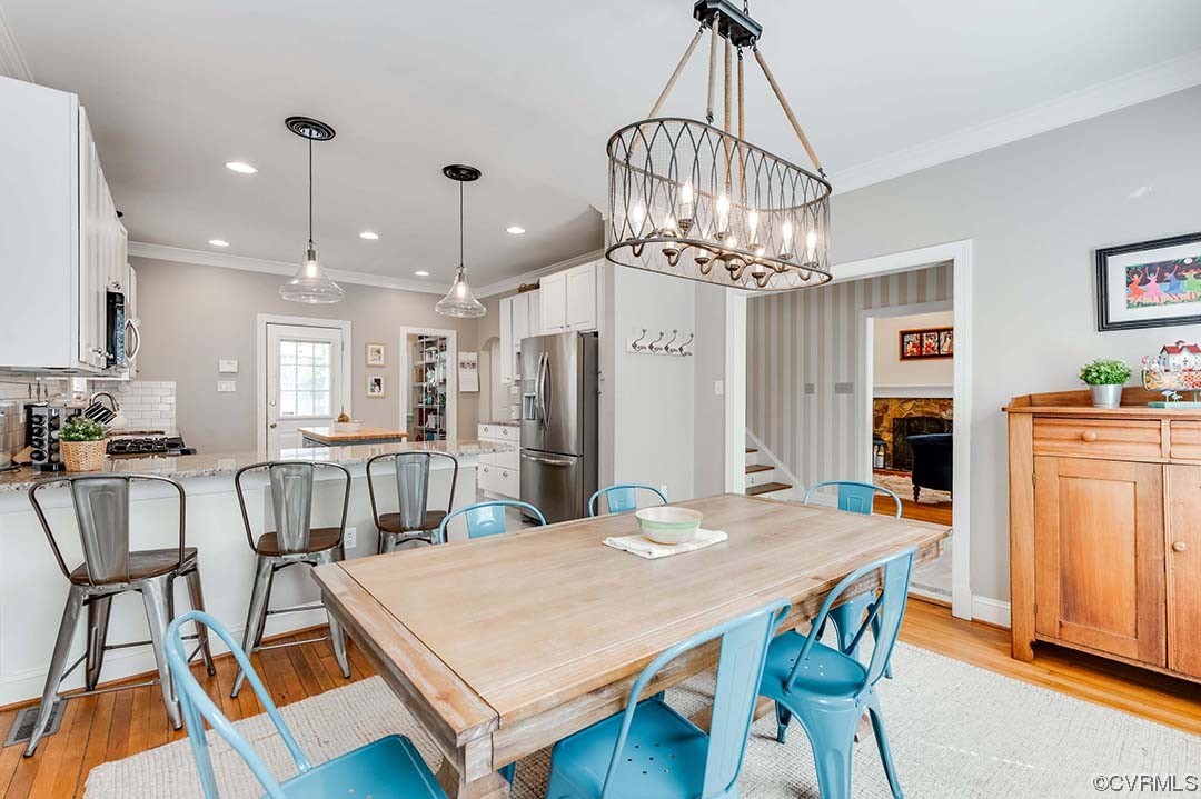 5009 Devonshire Road Richmond, VA 23225 - Photo 7 of 43 a view of a dining room with furniture and wooden floor