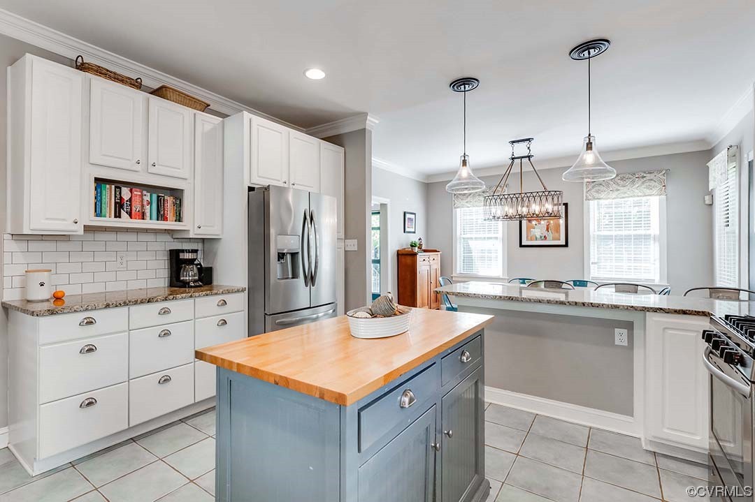 5009 Devonshire Road Richmond, VA 23225 - Photo 9 of 43 a kitchen with kitchen island granite countertop appliances cabinets and a sink