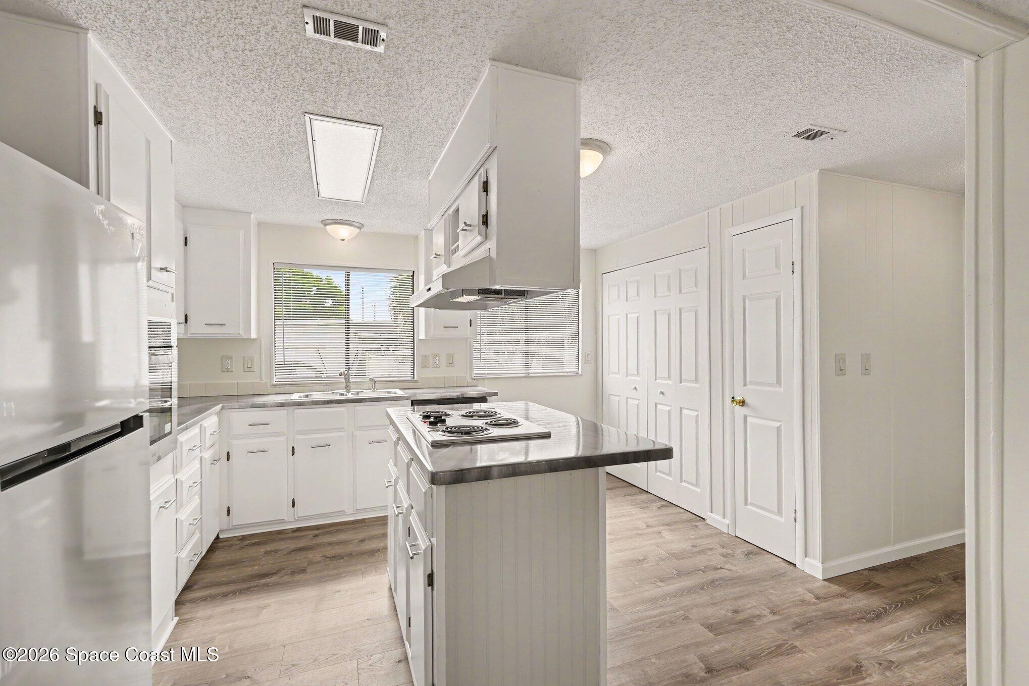 604 Breezeway Drive Cocoa, FL 32926 - Photo 7 of 26 Updated kitchen with island