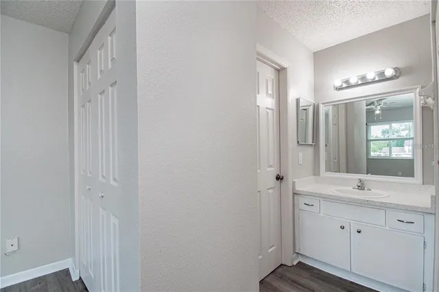 a bathroom with a double vanity sink and mirror