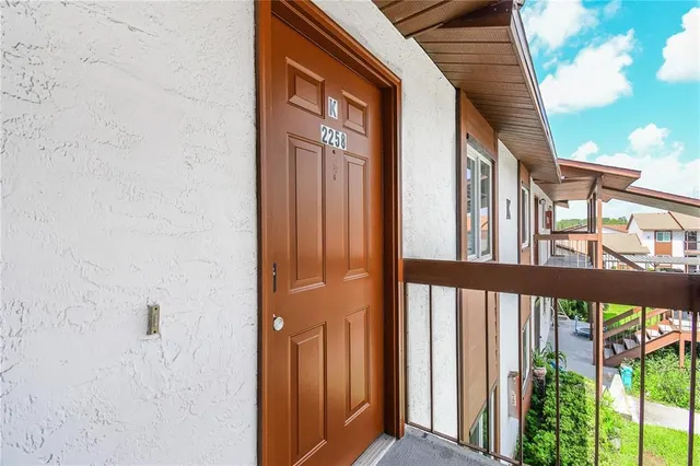 a view of a brick house with a large window