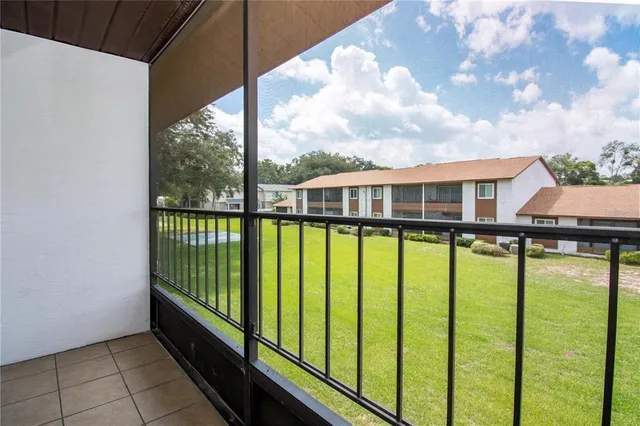 a view of a large building from a balcony