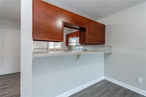 a room with cabinets and wooden floor