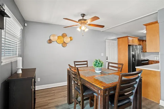 a view of a dining room with furniture and a window