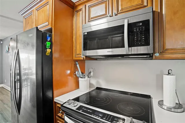 a kitchen with a stove and a microwave
